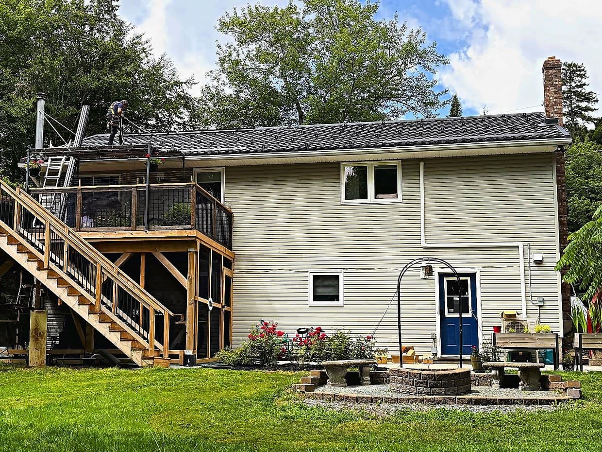 The back of a Nova Scotia home with a new metal roof and solar mounting rails installed
